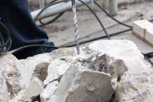 Drilling hole into concreteBreaking concrete